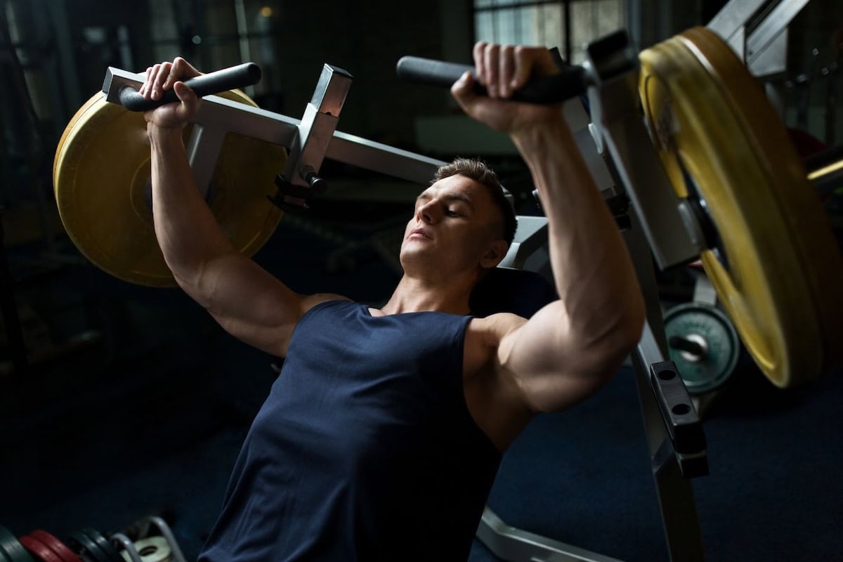 Man doing incline chest press machine